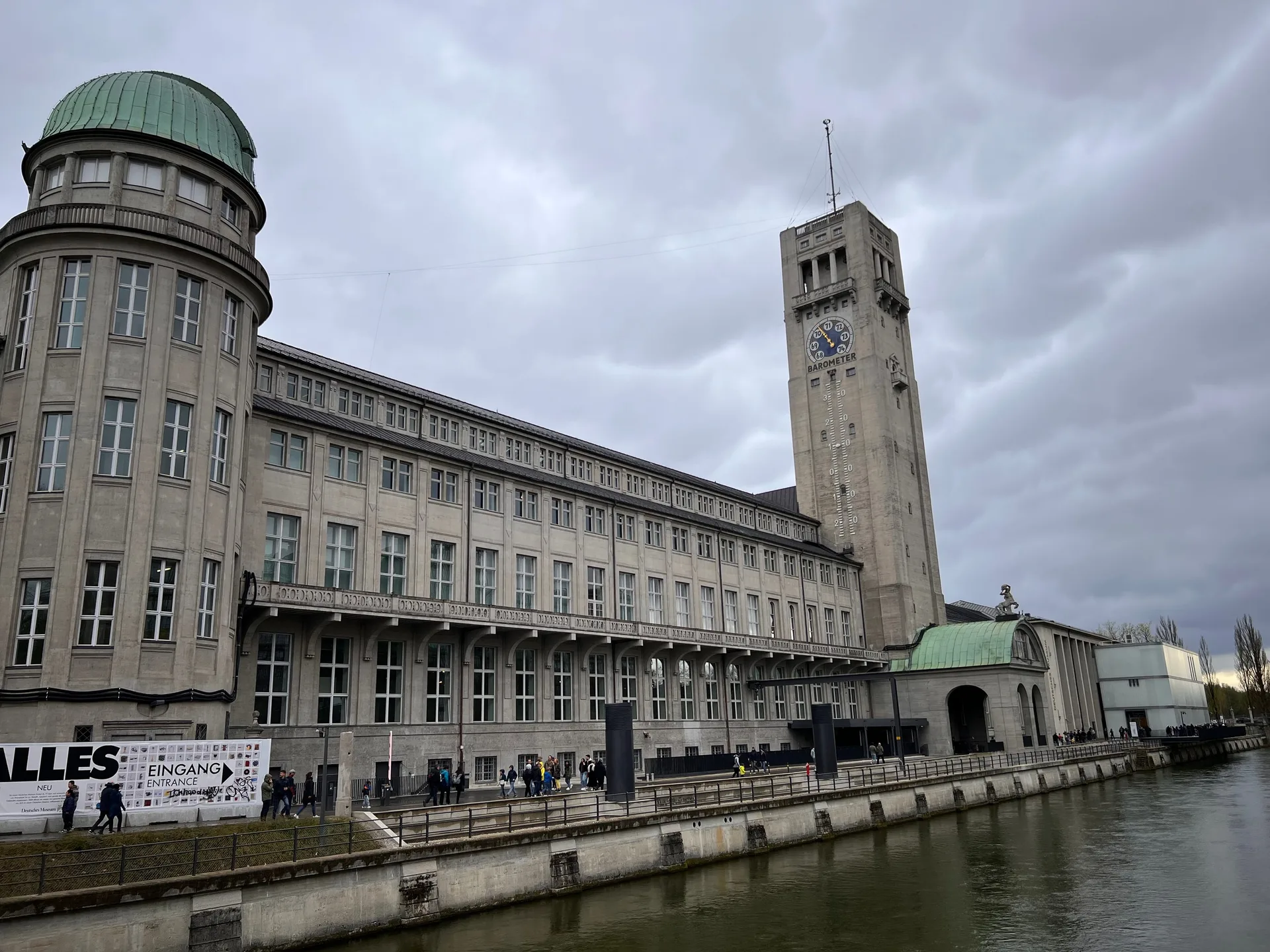 The Deutsches Museum on its island under a grey sky, its tower above the river.