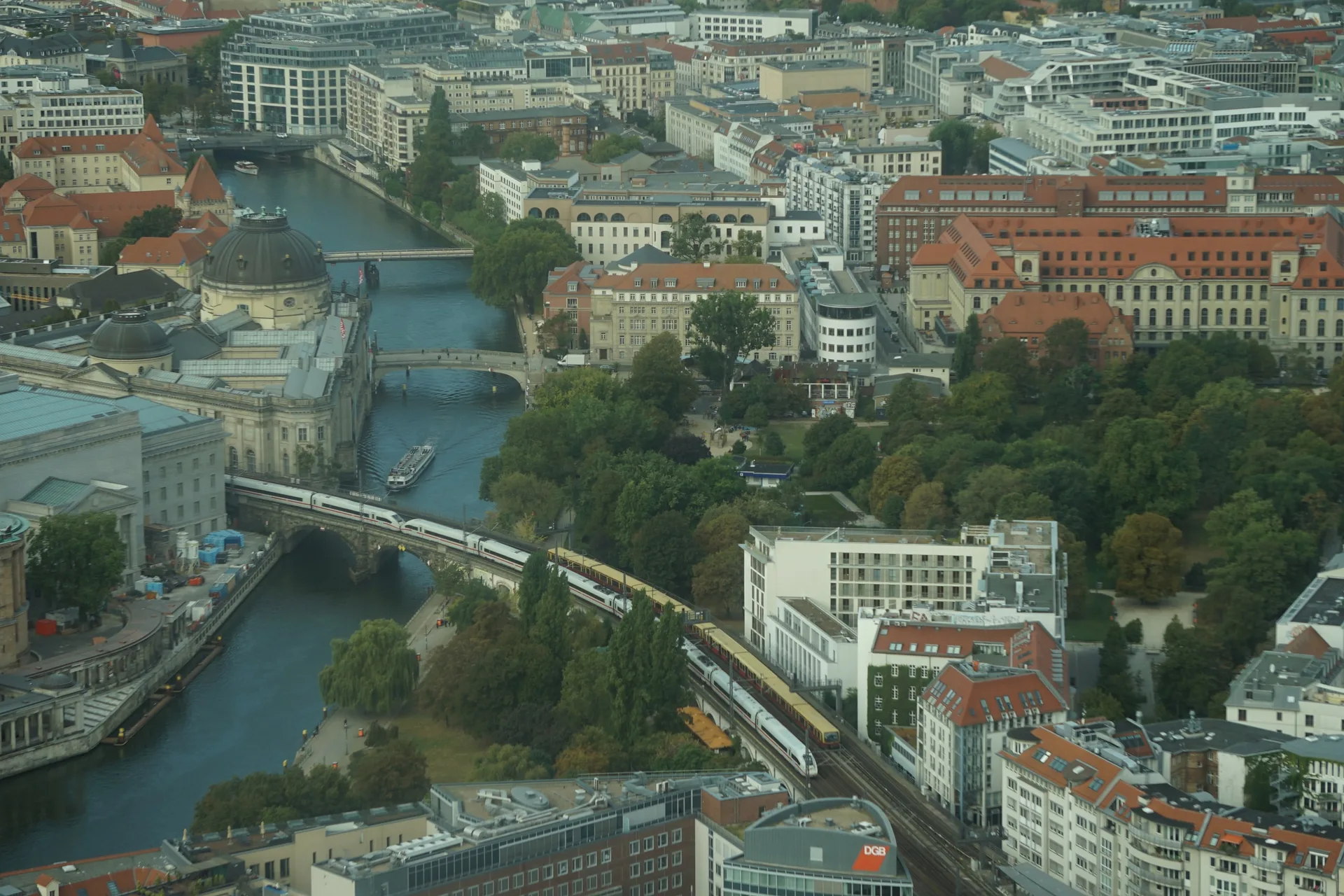 The Museumsinsel from above, a train crossing the viaduct over the Spree.